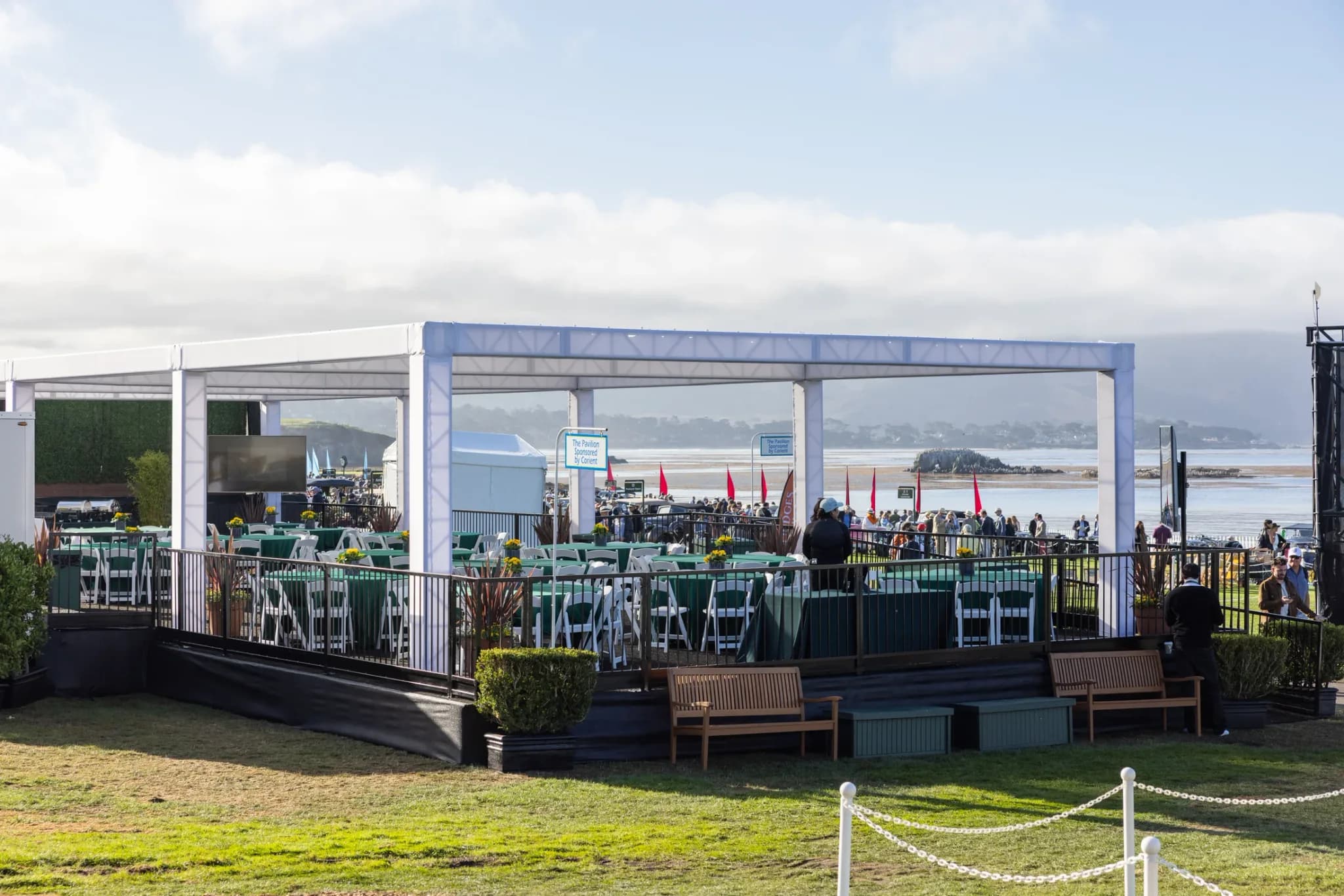 Glass-fronted hospitality structure with a furnished outdoor terrace